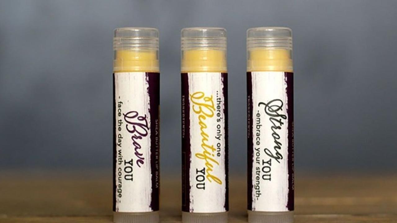 three tubes of beeswax lip balm