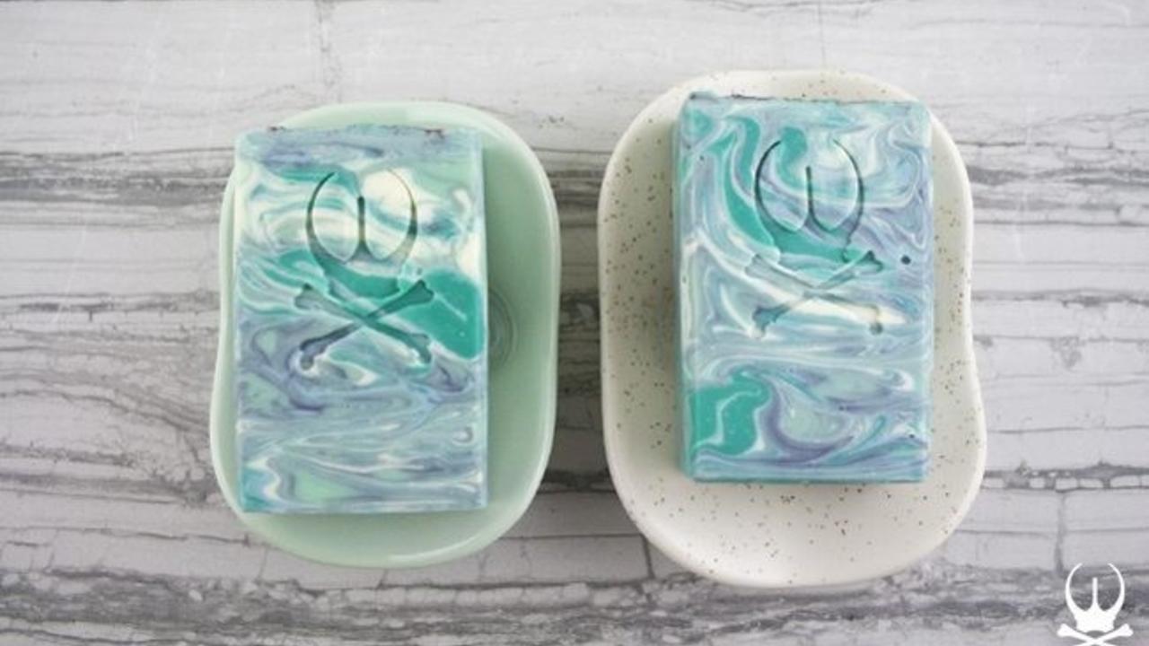two soaps sitting in soap dishes
